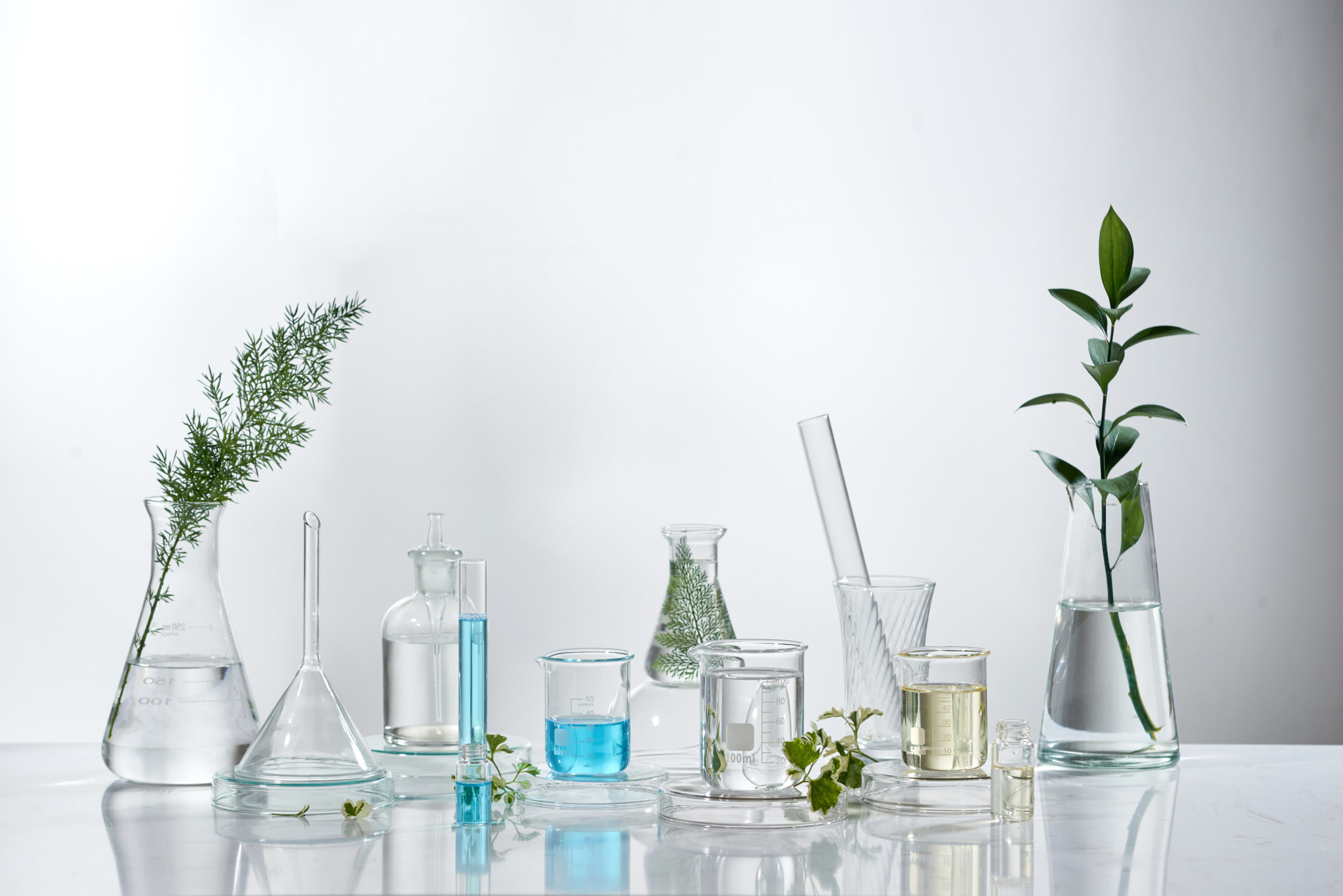 cosmetic laboratory research and development . science bio skincare cream serum product with leaves. natural organic beauty cosmetics concept. cosmetology.